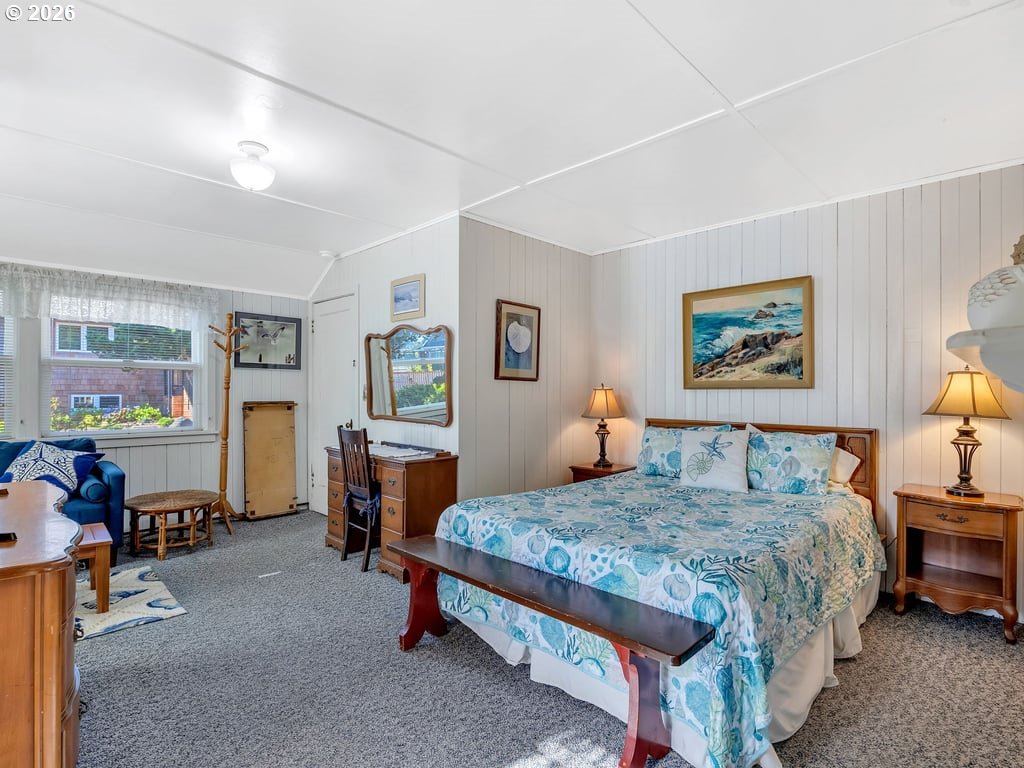 1081 South Promenade Seaside, OR 97138 - Photo 25 of 39 a bedroom with a bed and wooden floor