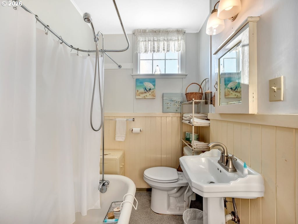 1081 South Promenade Seaside, OR 97138 - Photo 29 of 39 a bathroom with a sink a toilet and a mirror