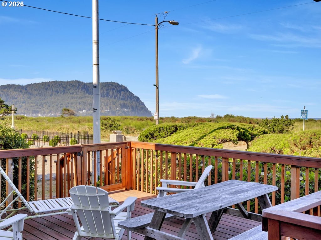1081 South Promenade Seaside, OR 97138 - Photo 7 of 39 a view of a balcony with chair and wooden floor