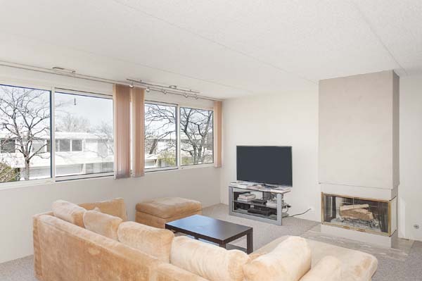 144 Wellington Road Northbrook, IL 60062 - Photo 8 of 20 a living room with furniture and a flat screen tv