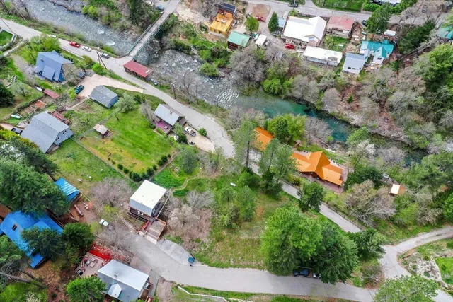 an aerial view of residential houses with outdoor space