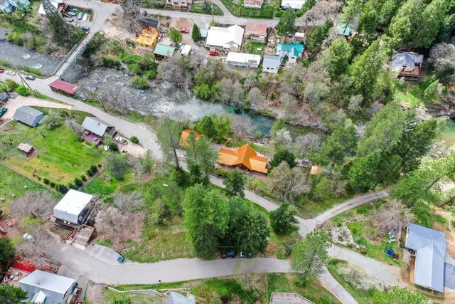 an aerial view of a house with a yard