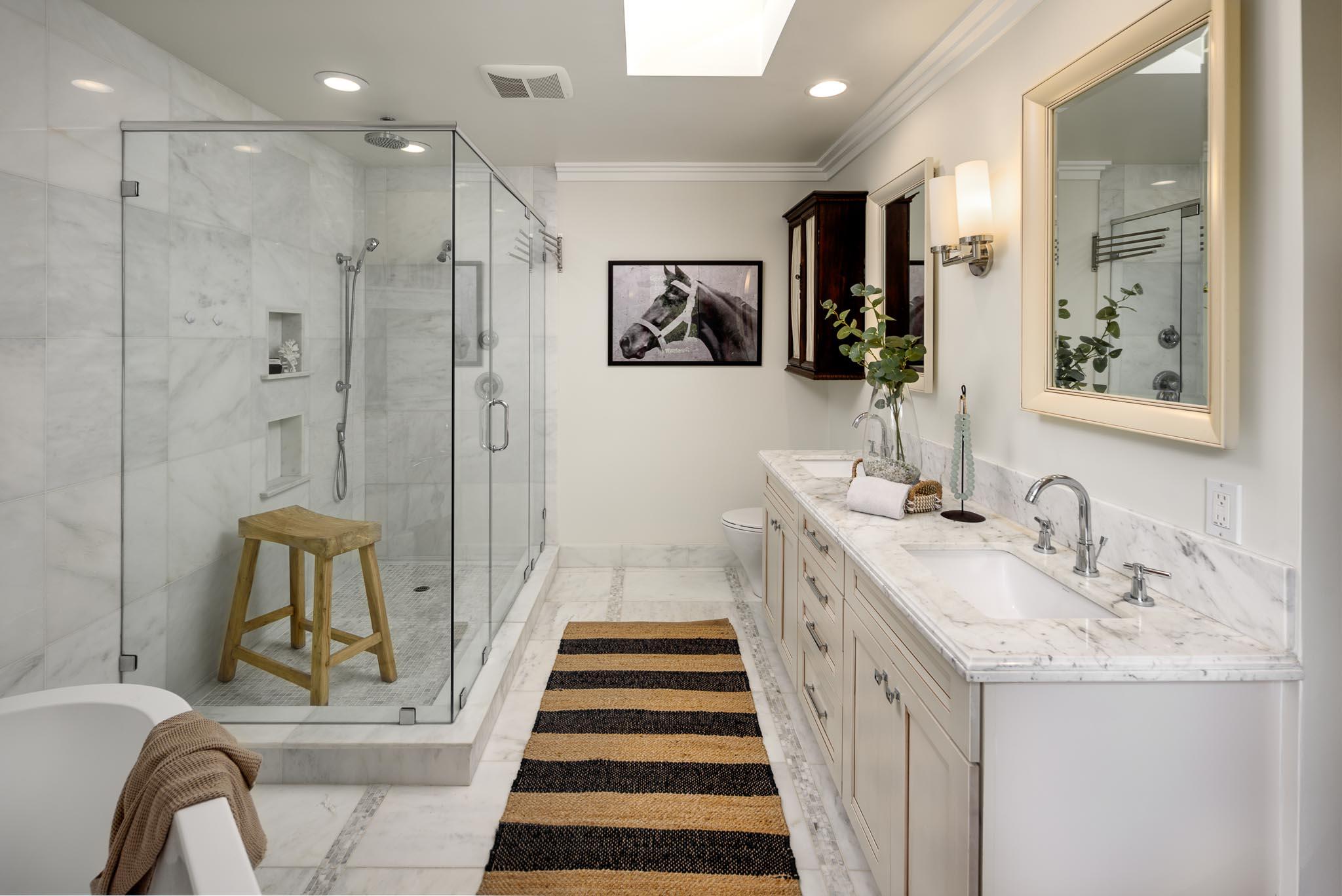 4375 Via Glorieta Santa Barbara, CA 93110 - Photo 12 of 36 a bathroom with a double vanity sink and a mirror
