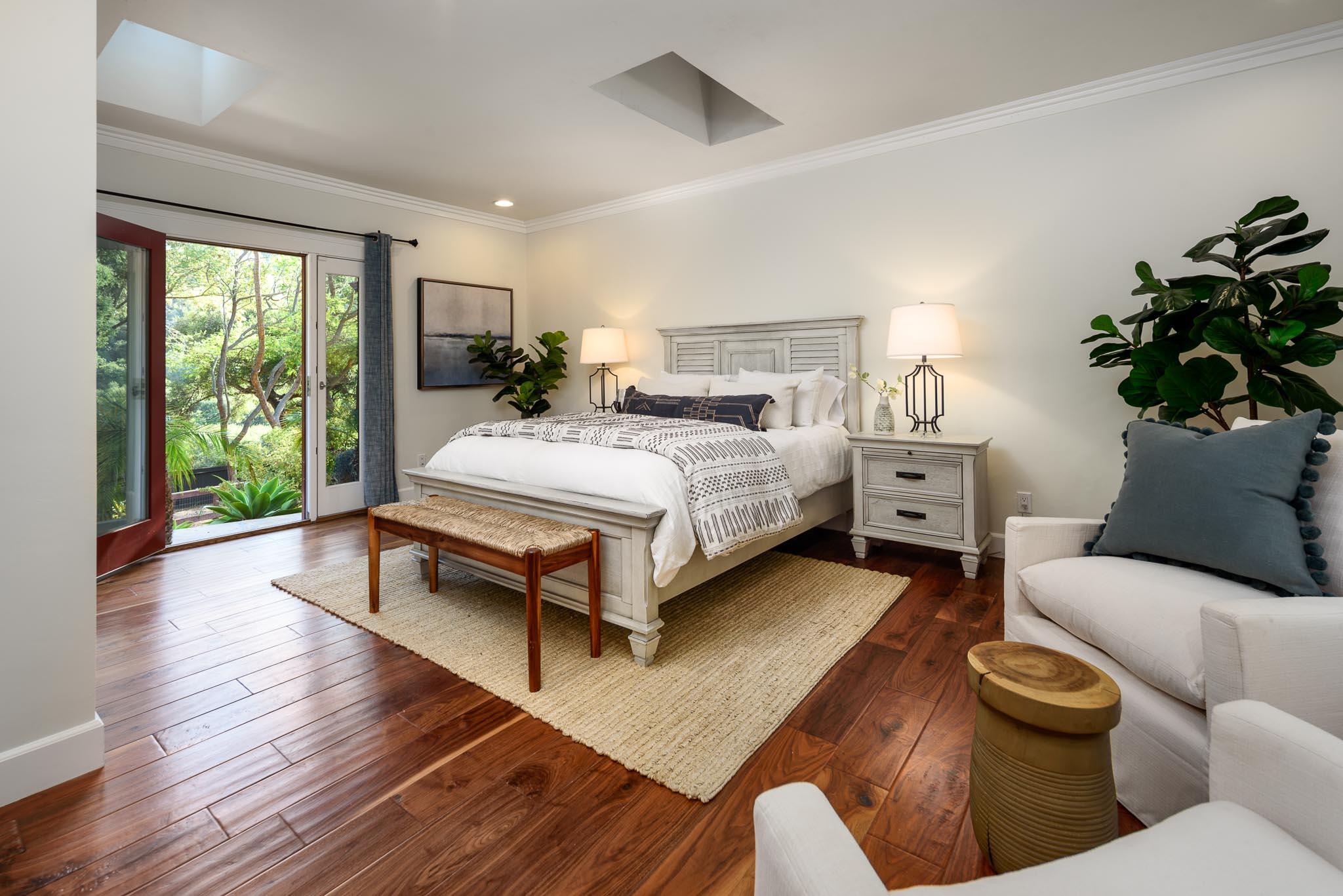 4375 Via Glorieta Santa Barbara, CA 93110 - Photo 14 of 36 a spacious bedroom with a bed and a potted plant