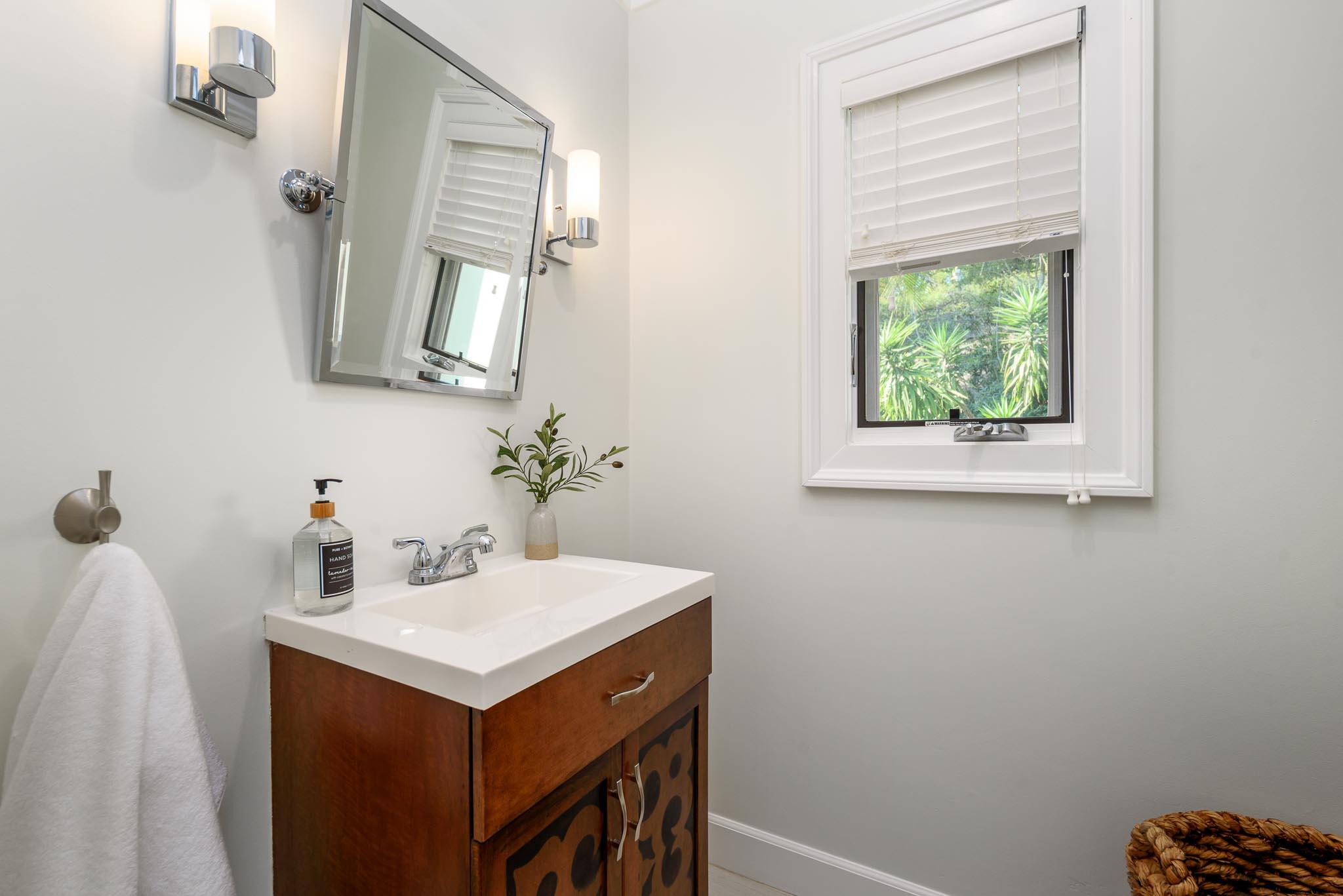 4375 Via Glorieta Santa Barbara, CA 93110 - Photo 18 of 36 a bathroom with a sink and a mirror