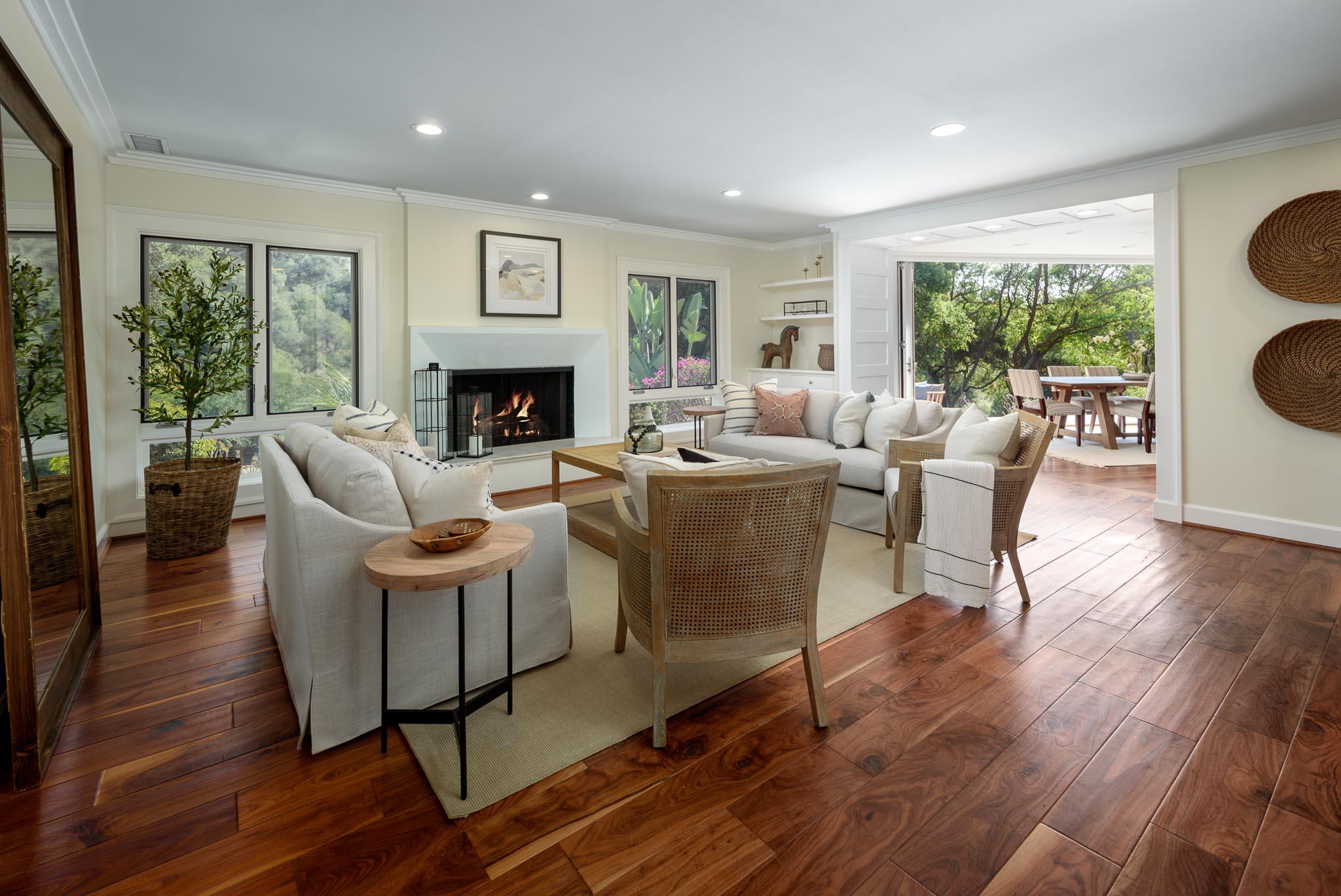 4375 Via Glorieta Santa Barbara, CA 93110 - Photo 4 of 36 a living room with fireplace furniture wooden floor and a large window