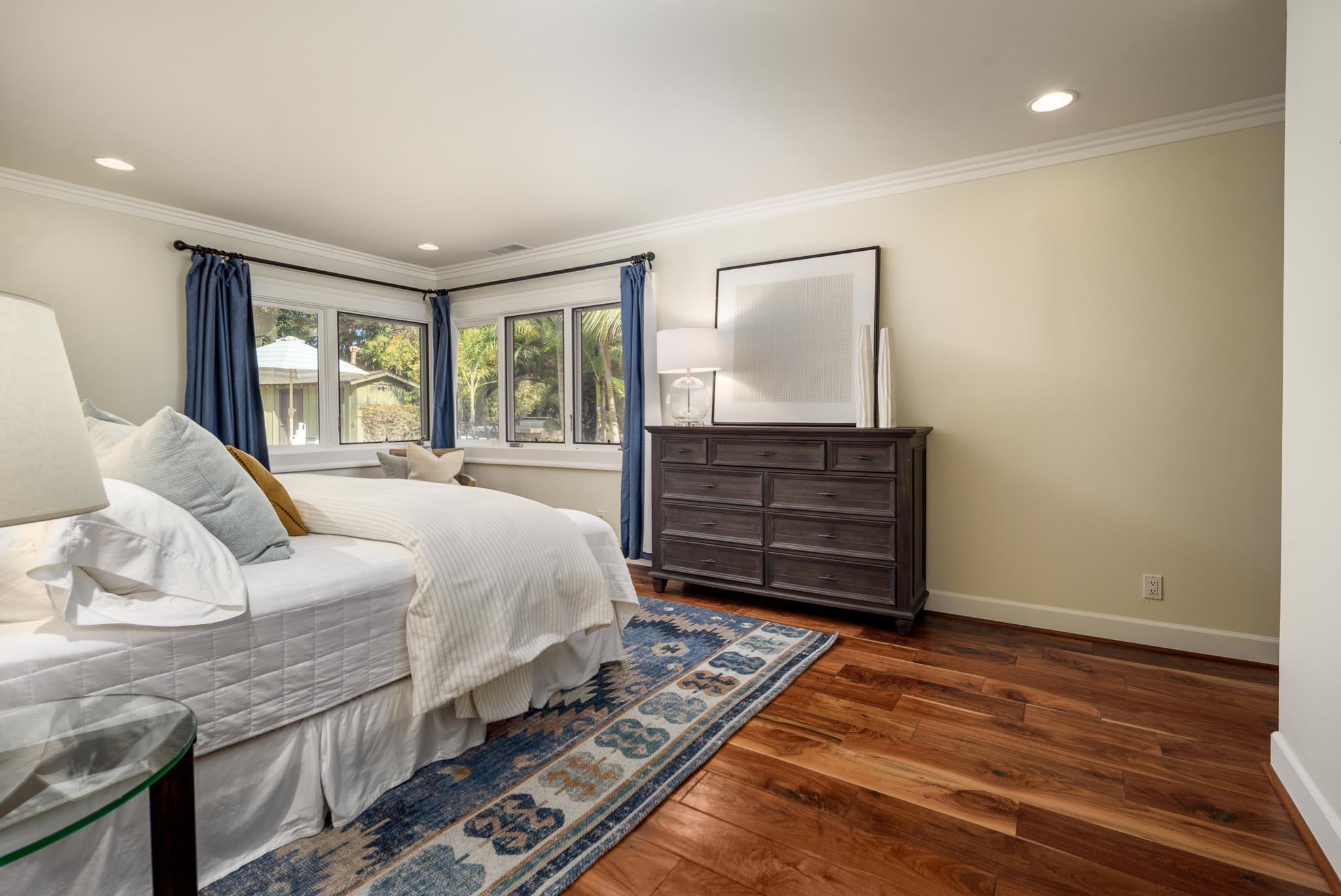 4375 Via Glorieta Santa Barbara, CA 93110 - Photo 10 of 36 a bedroom with a bed and wooden floor