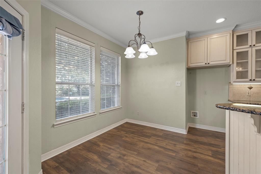 5624 Rosalie Drive Waco, TX 76708 - Photo 12 of 39 an empty room with wooden floor and windows