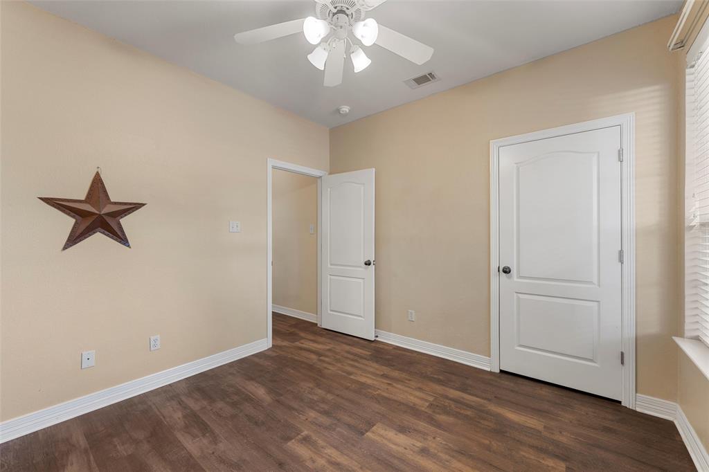 5624 Rosalie Drive Waco, TX 76708 - Photo 24 of 39 wooden floor in an empty room with a window