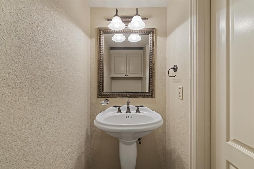 5624 Rosalie Drive Waco, TX 76708 - Photo 26 of 39 a bathroom with a sink and a mirror