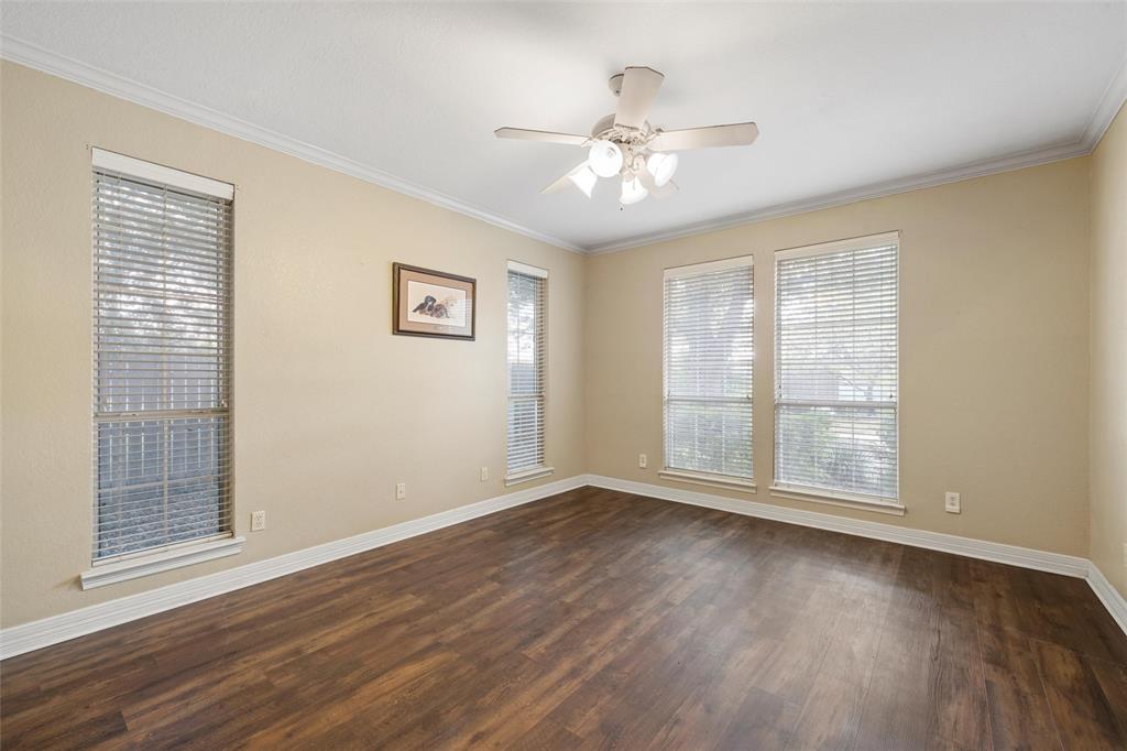 5624 Rosalie Drive Waco, TX 76708 - Photo 27 of 39 a view of an empty room with wooden floor and a window