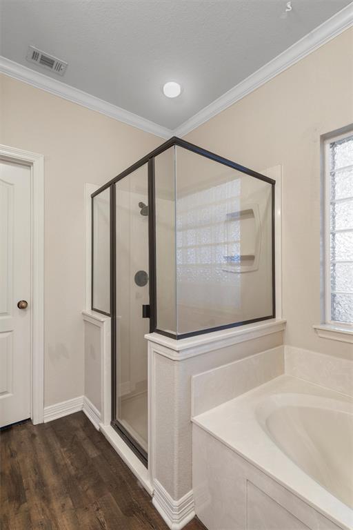 5624 Rosalie Drive Waco, TX 76708 - Photo 30 of 39 a bathroom with a shower and a tub