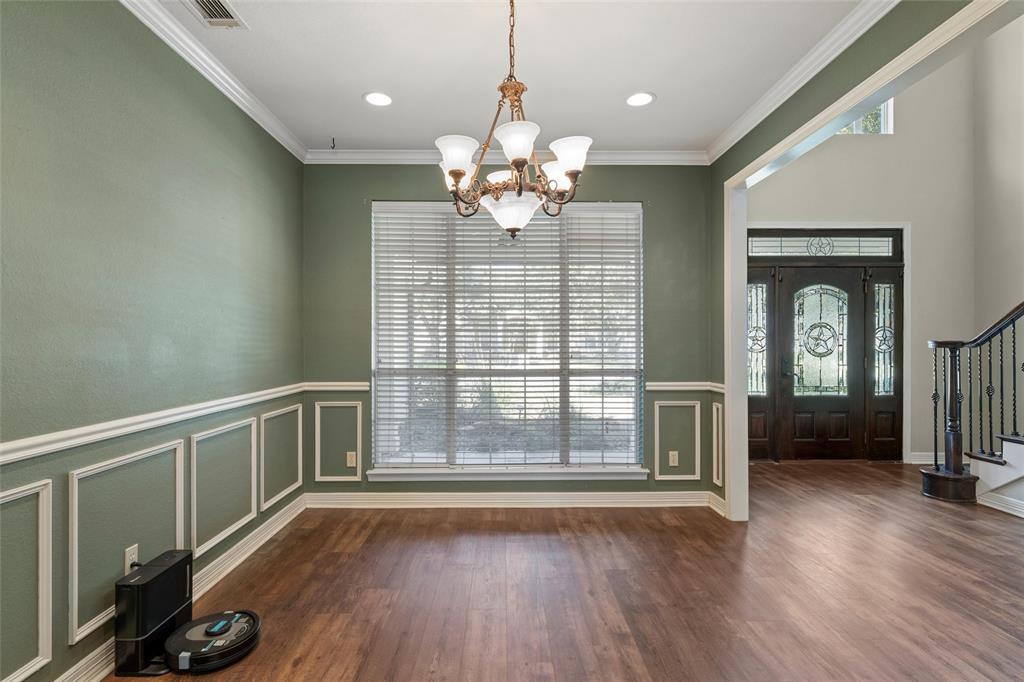 5624 Rosalie Drive Waco, TX 76708 - Photo 6 of 39 a view of an empty room with wooden floor and a window