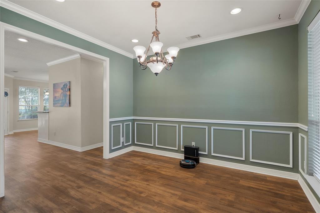 5624 Rosalie Drive Waco, TX 76708 - Photo 7 of 39 a view of an empty room with wooden floor