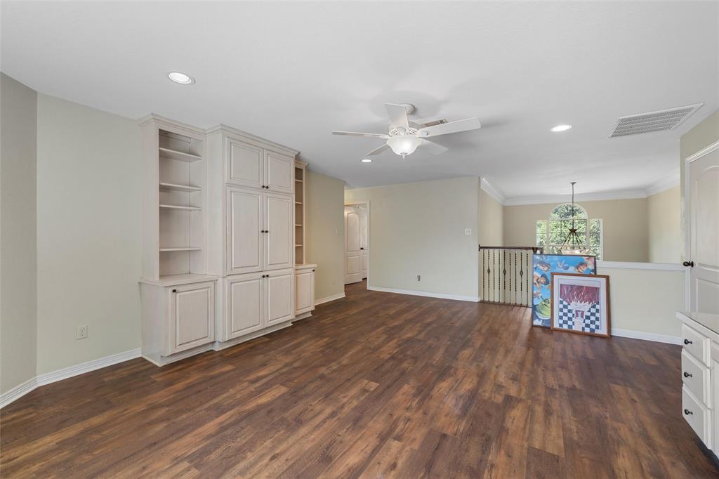 5624 Rosalie Drive Waco, TX 76708 - Photo 9 of 39 a view of a room with wooden floor and window