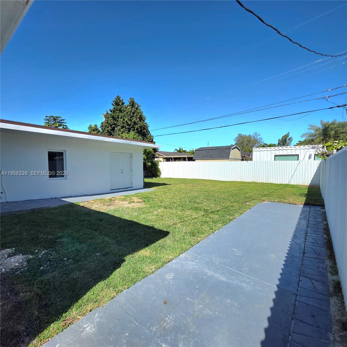 7555 Southwest 28th Street Road Miami, FL 33155 - Photo 11 of 11 a view of a backyard with tv