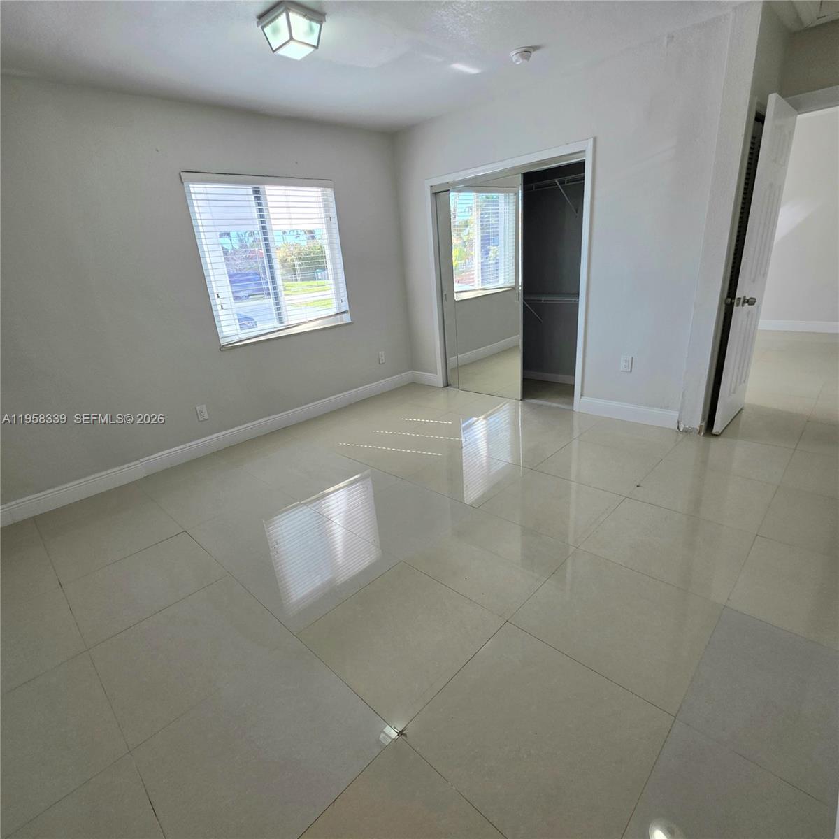 7555 Southwest 28th Street Road Miami, FL 33155 - Photo 5 of 11 a view of an empty room with a window