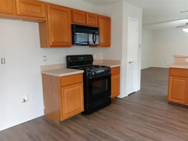 a kitchen with a stove and a microwave