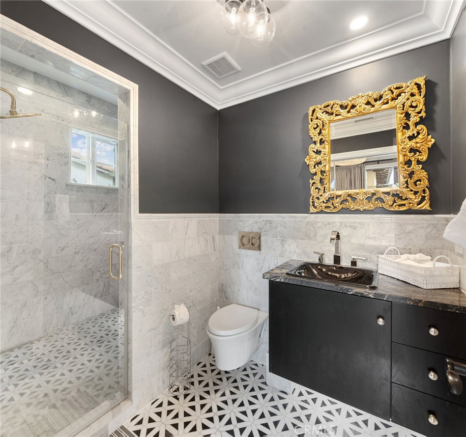 33 Basilica Place Ladera Ranch, CA 92694 - Photo 26 of 59 a bathroom with a sink toilet and shower