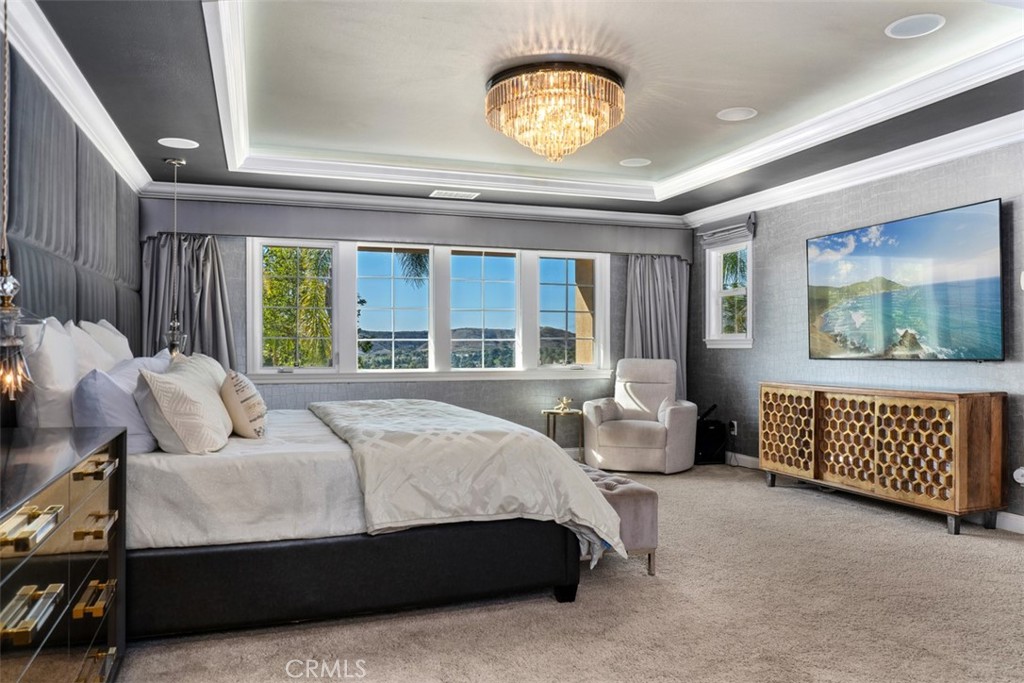 33 Basilica Place Ladera Ranch, CA 92694 - Photo 28 of 59 a bedroom with a bed and a large window