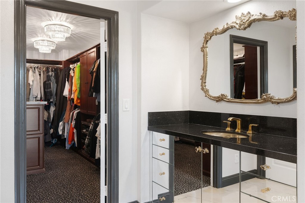 33 Basilica Place Ladera Ranch, CA 92694 - Photo 34 of 59 a view of a hallway with a mirror and furniture