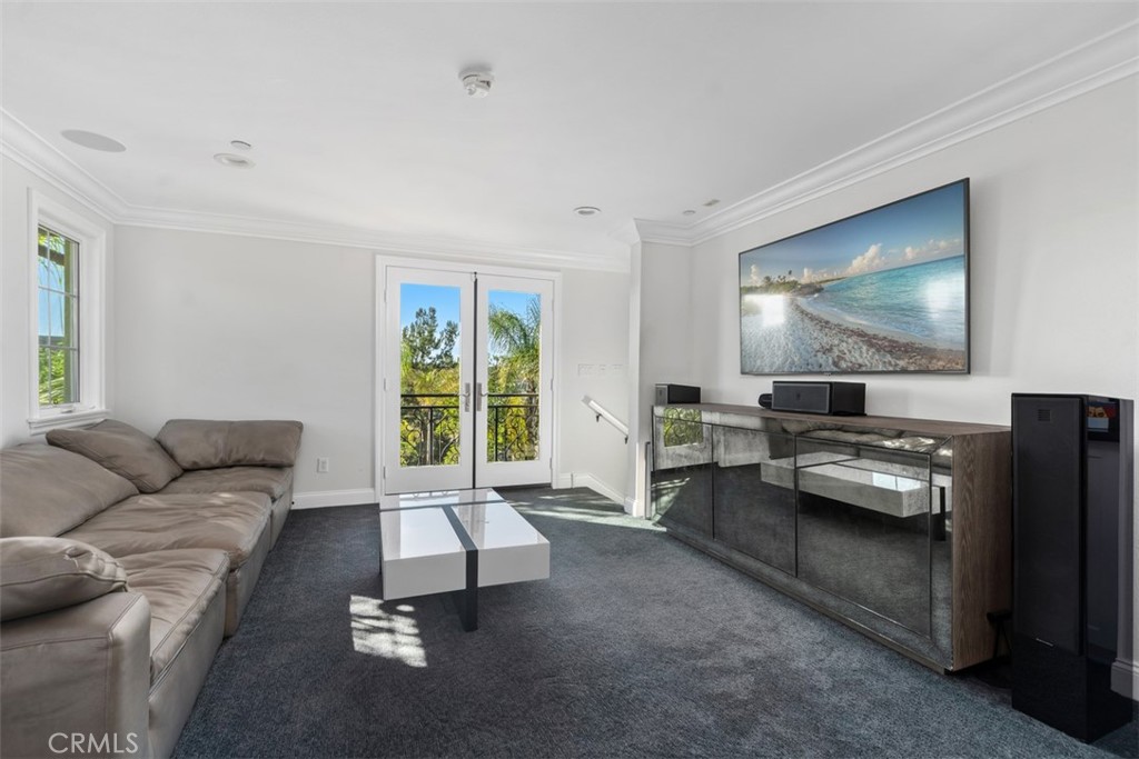 33 Basilica Place Ladera Ranch, CA 92694 - Photo 36 of 59 a living room with furniture and a flat screen tv