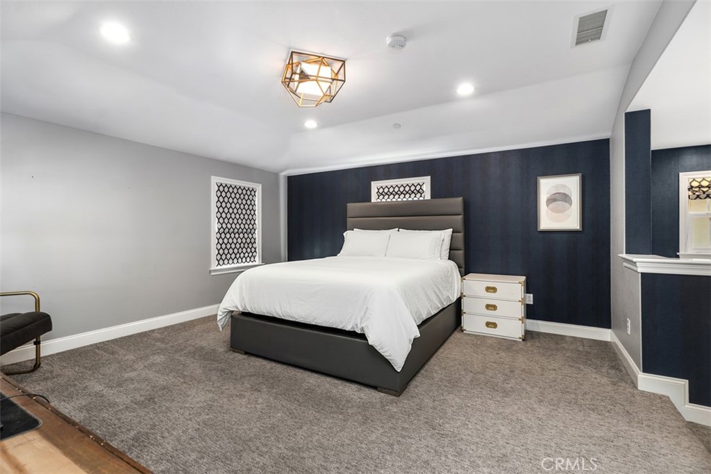 33 Basilica Place Ladera Ranch, CA 92694 - Photo 38 of 59 a bedroom with a bed and a window
