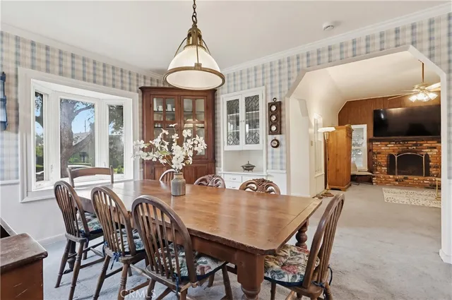 a view of a dining room with furniture window and outside view