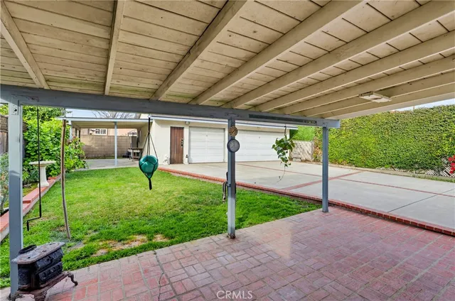 a view of a house with backyard and porch