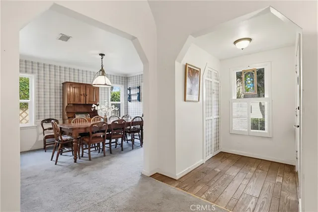 a view of a livingroom with furniture and chandelier