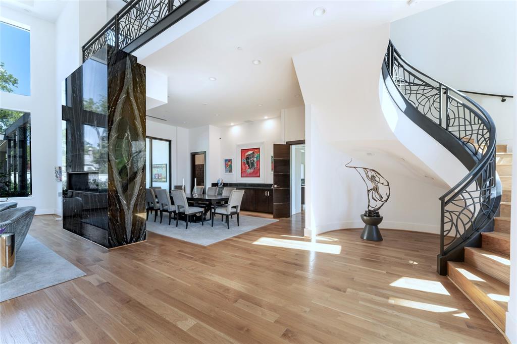 5959 Colhurst Street Dallas, TX 75230 - Photo 12 of 35 a living room with furniture and a wooden floor