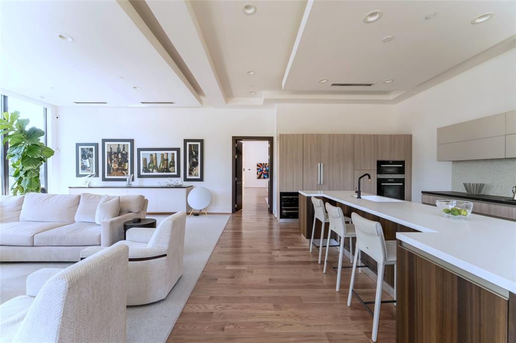 5959 Colhurst Street Dallas, TX 75230 - Photo 13 of 35 a living room with furniture and a wooden floor