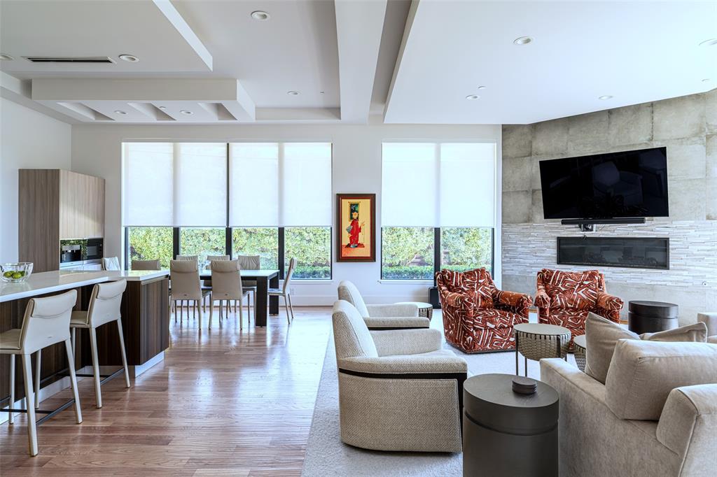 5959 Colhurst Street Dallas, TX 75230 - Photo 20 of 35 a living room with furniture and a flat screen tv