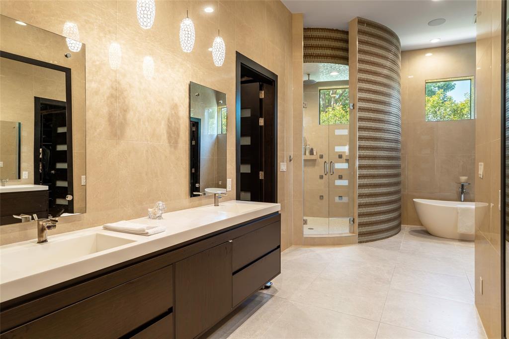 5959 Colhurst Street Dallas, TX 75230 - Photo 24 of 35 a bathroom with a double vanity sink mirror and a bathtub
