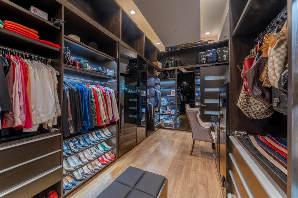 5959 Colhurst Street Dallas, TX 75230 - Photo 25 of 35 a view of walk in closet with clothes and shoes