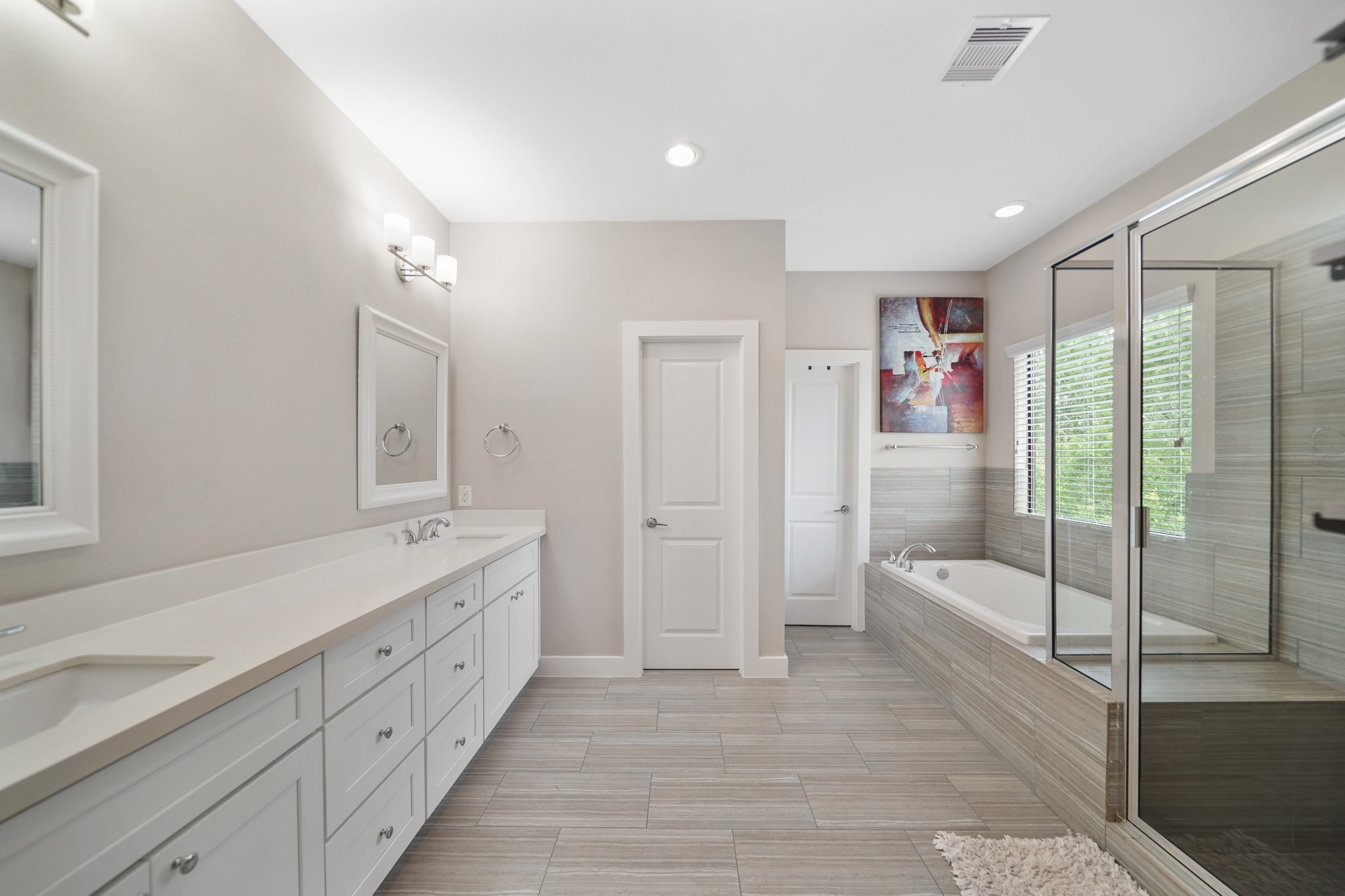 1824 Bonner Street Houston, TX 77007 - Photo 25 of 39 a spacious bathroom with a double vanity sink and a large mirror
