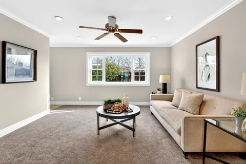 a living room with furniture and window
