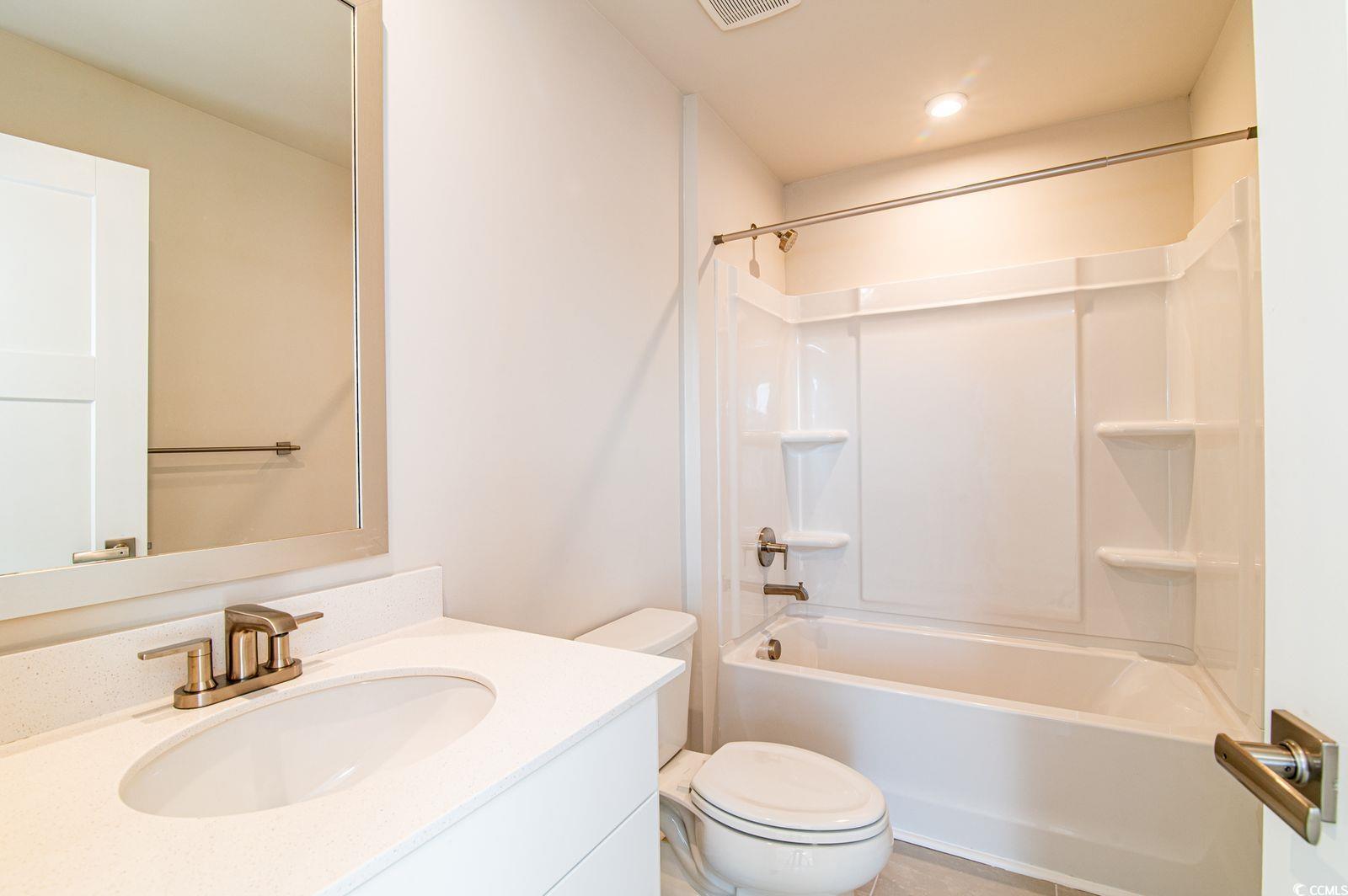 2812 Rowyn Street Longs, SC 29568 - Photo 14 of 27 Full bath featuring vanity and washtub / shower combination