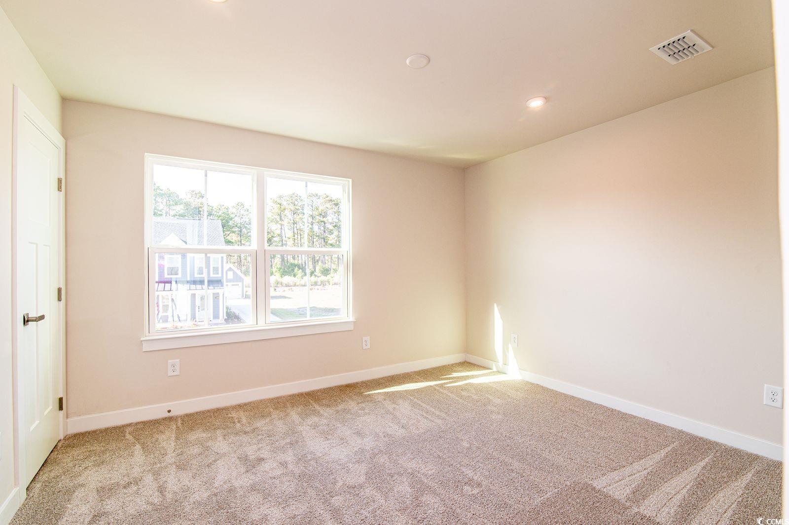 2812 Rowyn Street Longs, SC 29568 - Photo 17 of 27 Unfurnished bedroom with light colored carpet and recessed lighting