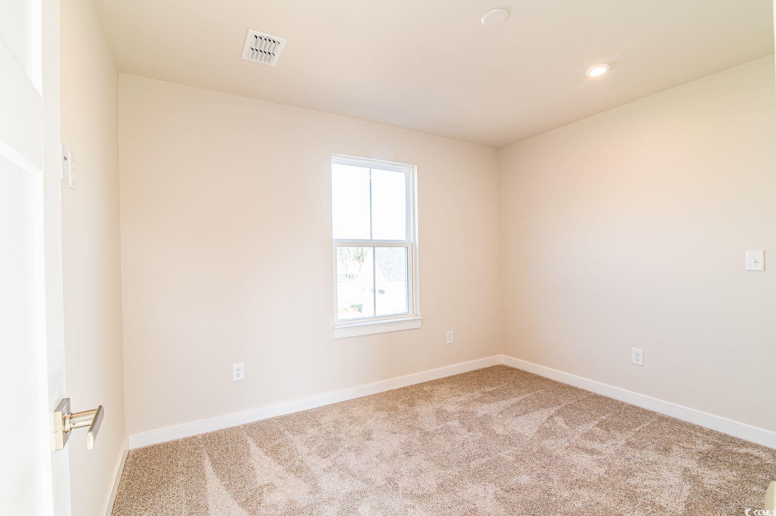 2812 Rowyn Street Longs, SC 29568 - Photo 19 of 27 Unfurnished room featuring light colored carpet and baseboards