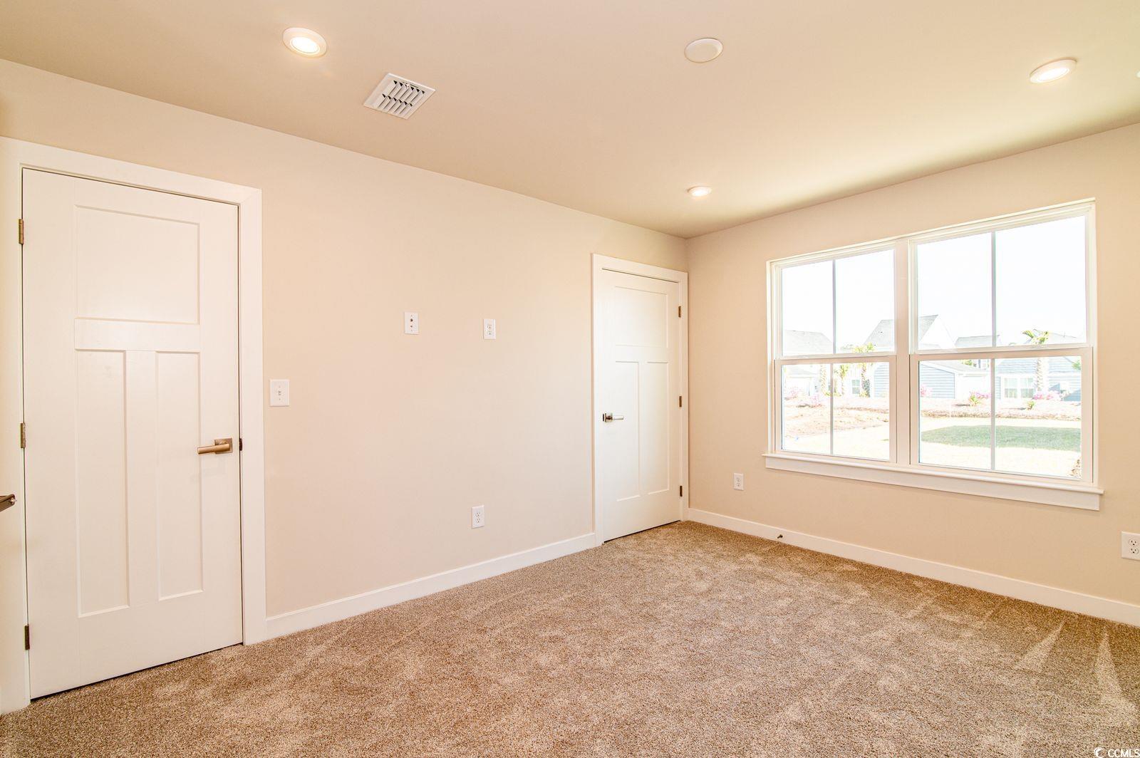 2812 Rowyn Street Longs, SC 29568 - Photo 7 of 27 Unfurnished bedroom featuring light carpet and recessed lighting