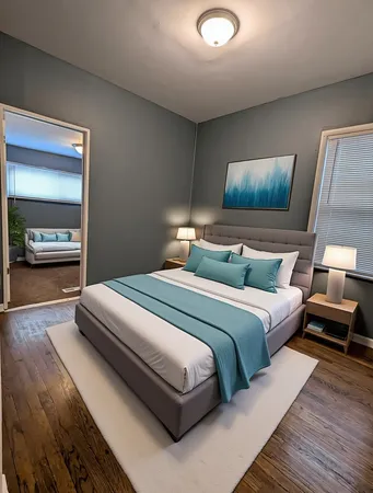 a bedroom with a bed and a large mirror