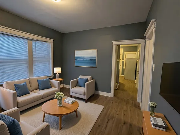 a living room with furniture and a flat screen tv