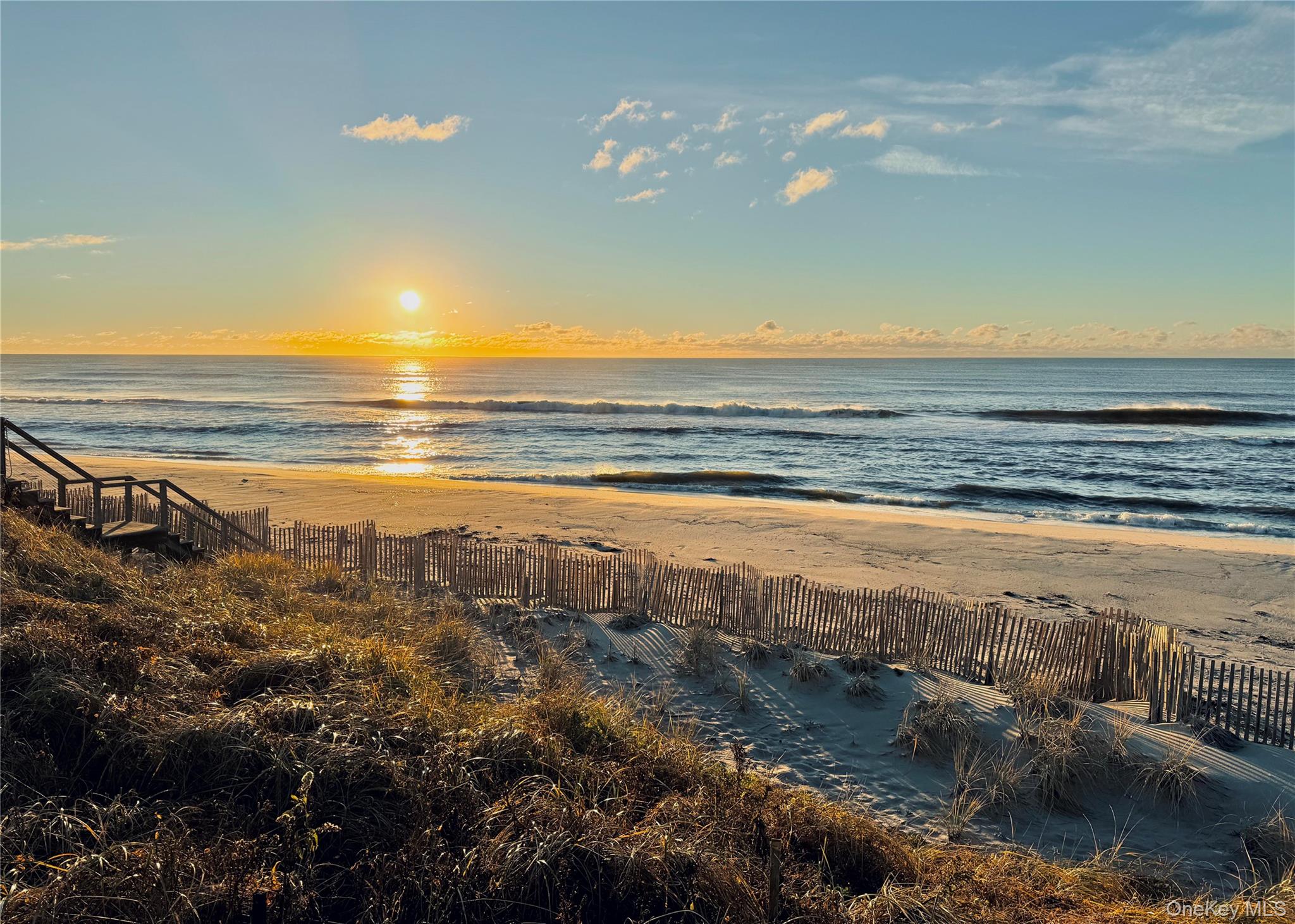 162 Dune Road Quogue, NY 11959 - Photo 20 of 28 a view of an ocean and beach
