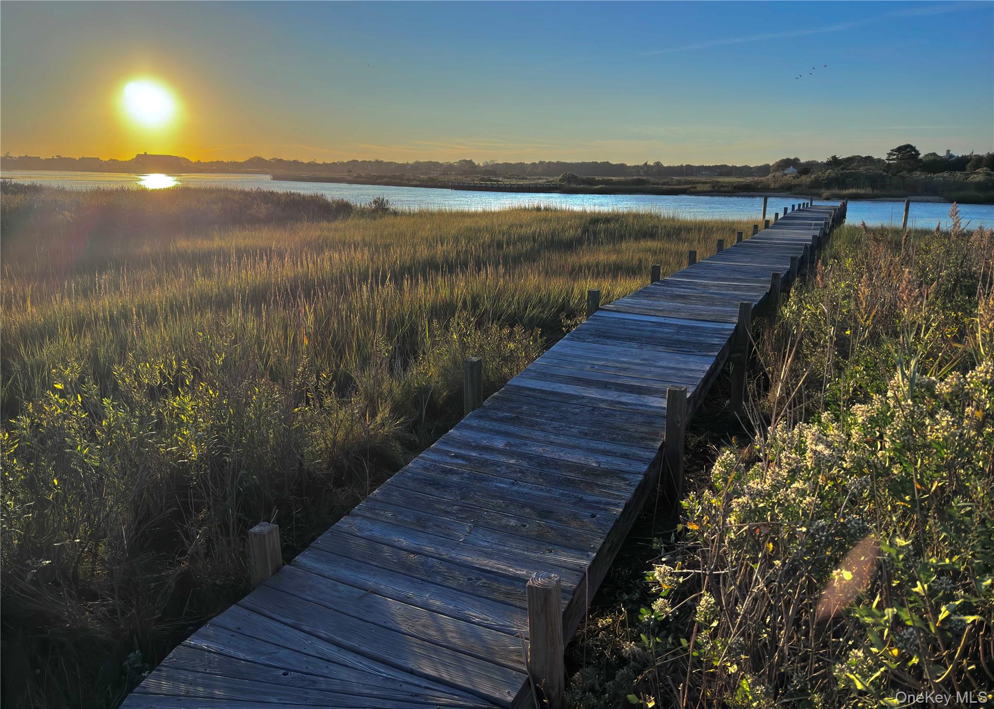 162 Dune Road Quogue, NY 11959 - Photo 23 of 28 a view of outside space with lake view