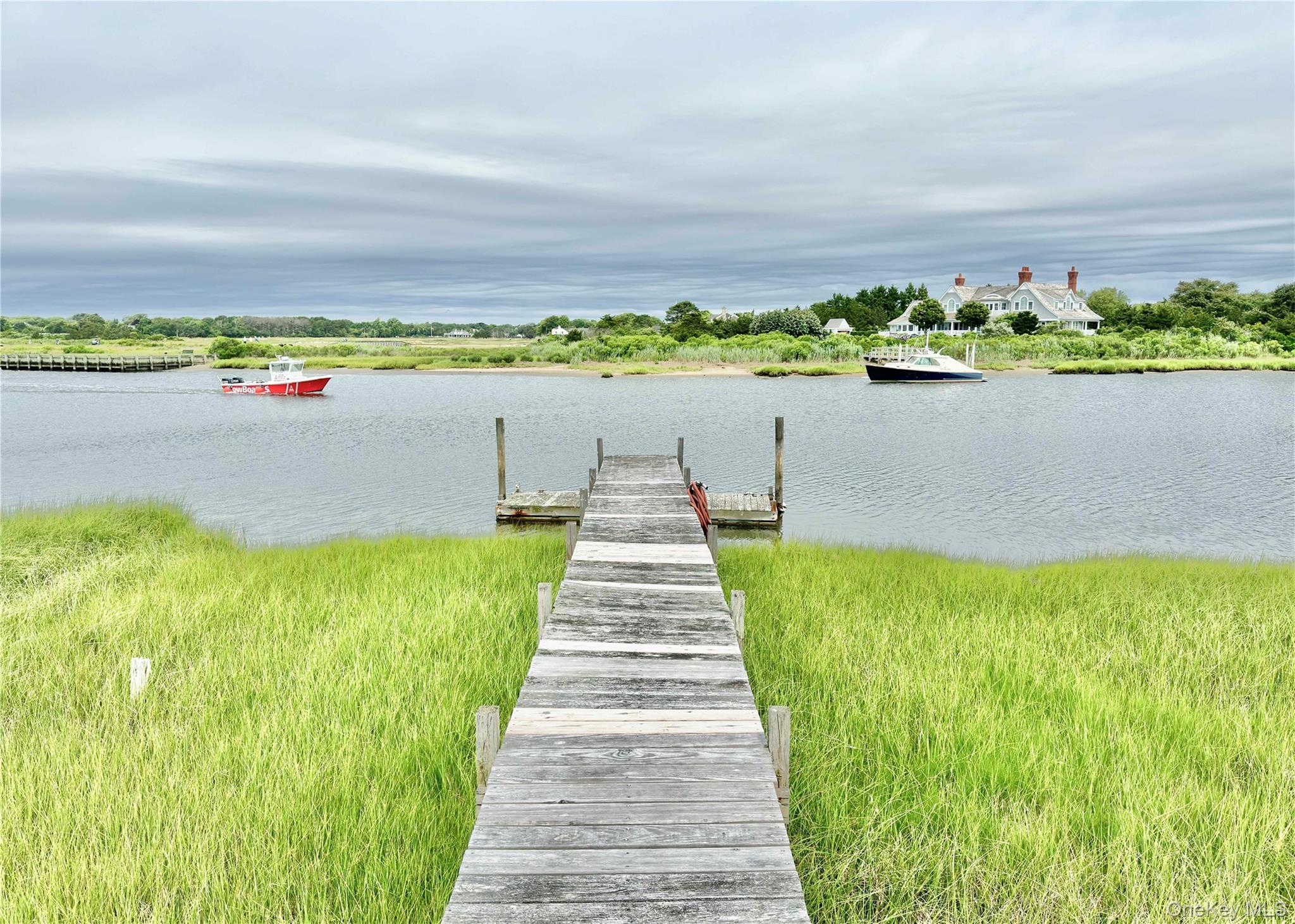 162 Dune Road Quogue, NY 11959 - Photo 24 of 28 a view of lake with green space