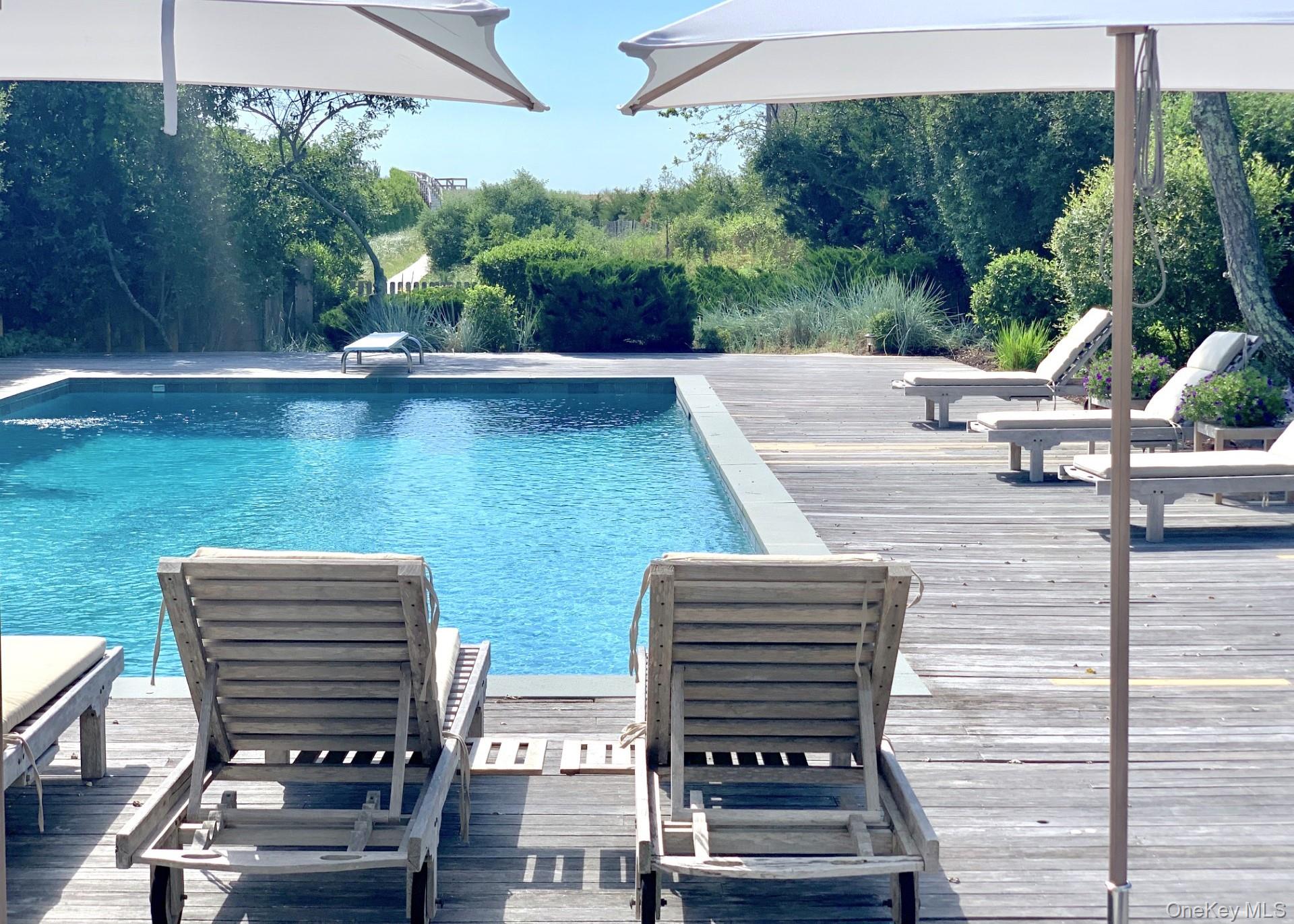 162 Dune Road Quogue, NY 11959 - Photo 3 of 28 a view of outdoor space area and patio