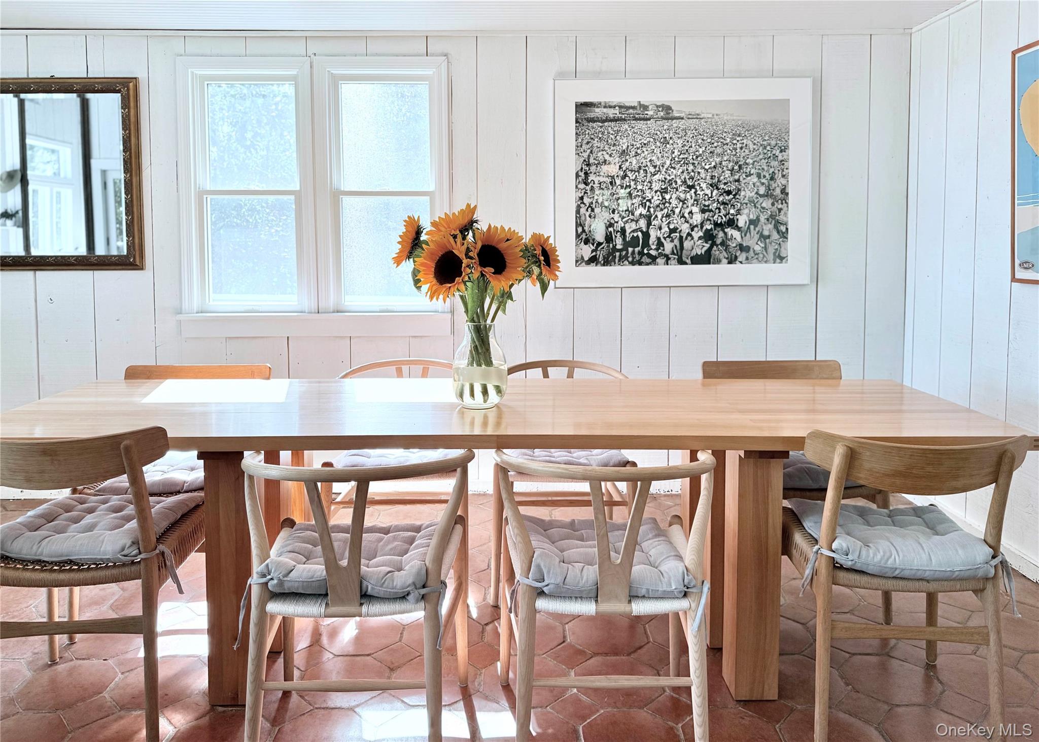 162 Dune Road Quogue, NY 11959 - Photo 9 of 28 a view of a dining room with furniture and a window