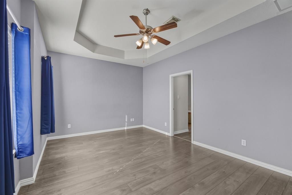 4027 Rome Court Irving, TX 75038 - Photo 15 of 33 a view of an empty room with wooden floor