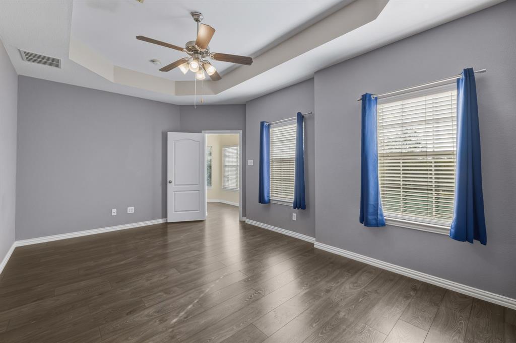 4027 Rome Court Irving, TX 75038 - Photo 17 of 33 a view of an empty room with wooden floor and a window